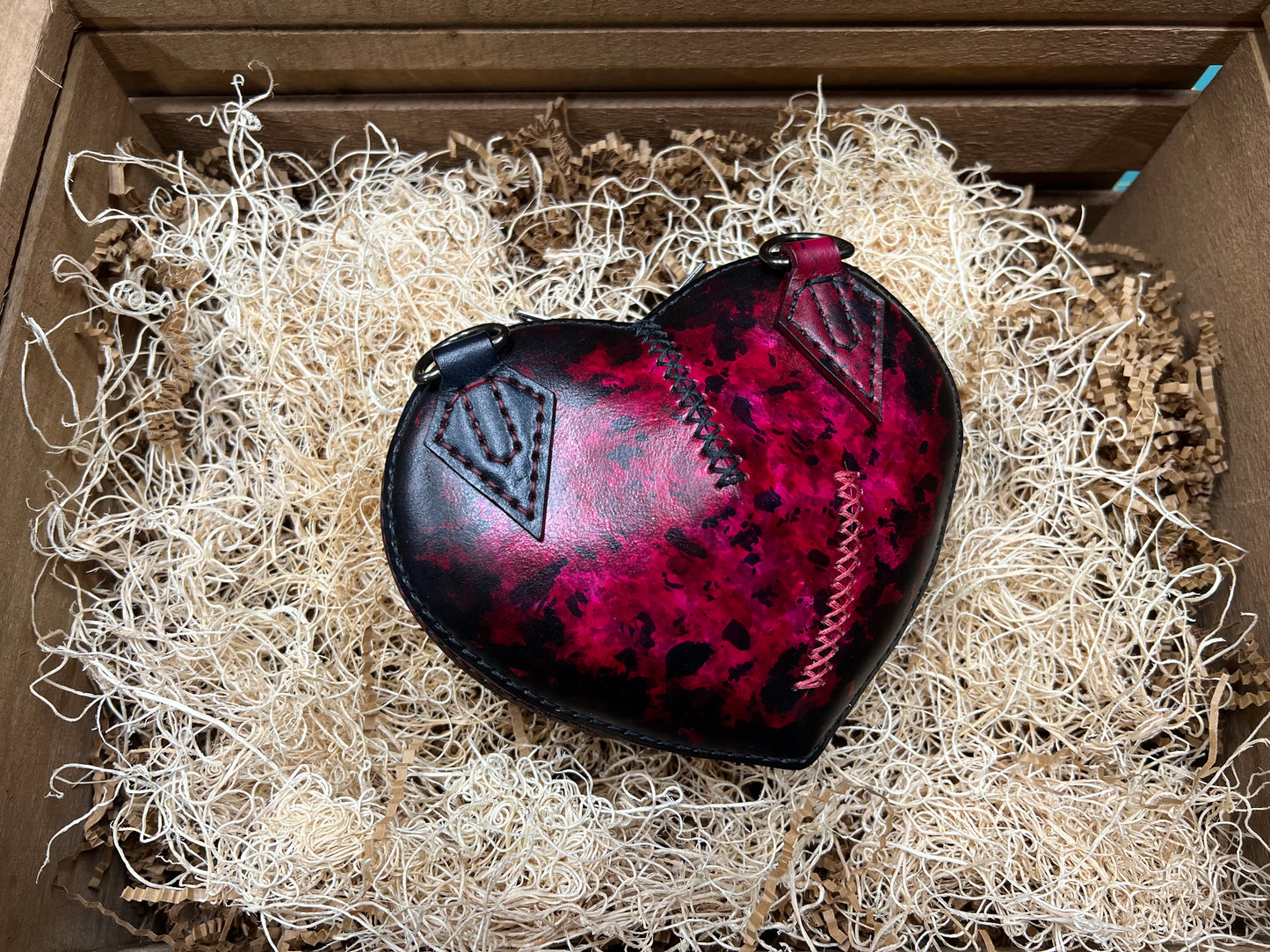 Broken heart leather handbag