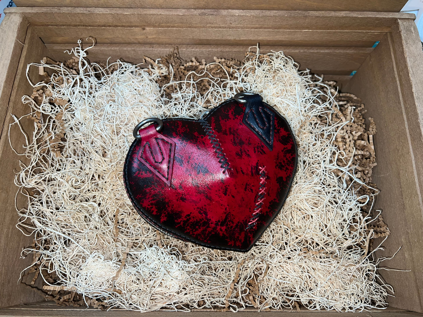 Broken heart leather handbag