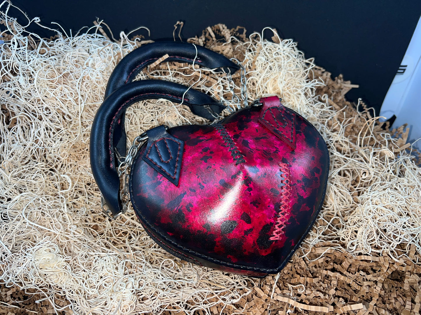 Broken heart leather handbag