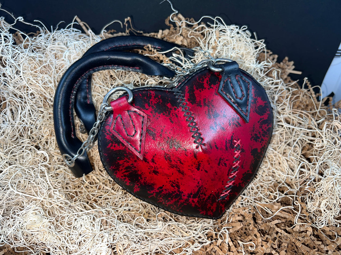 Broken heart leather handbag